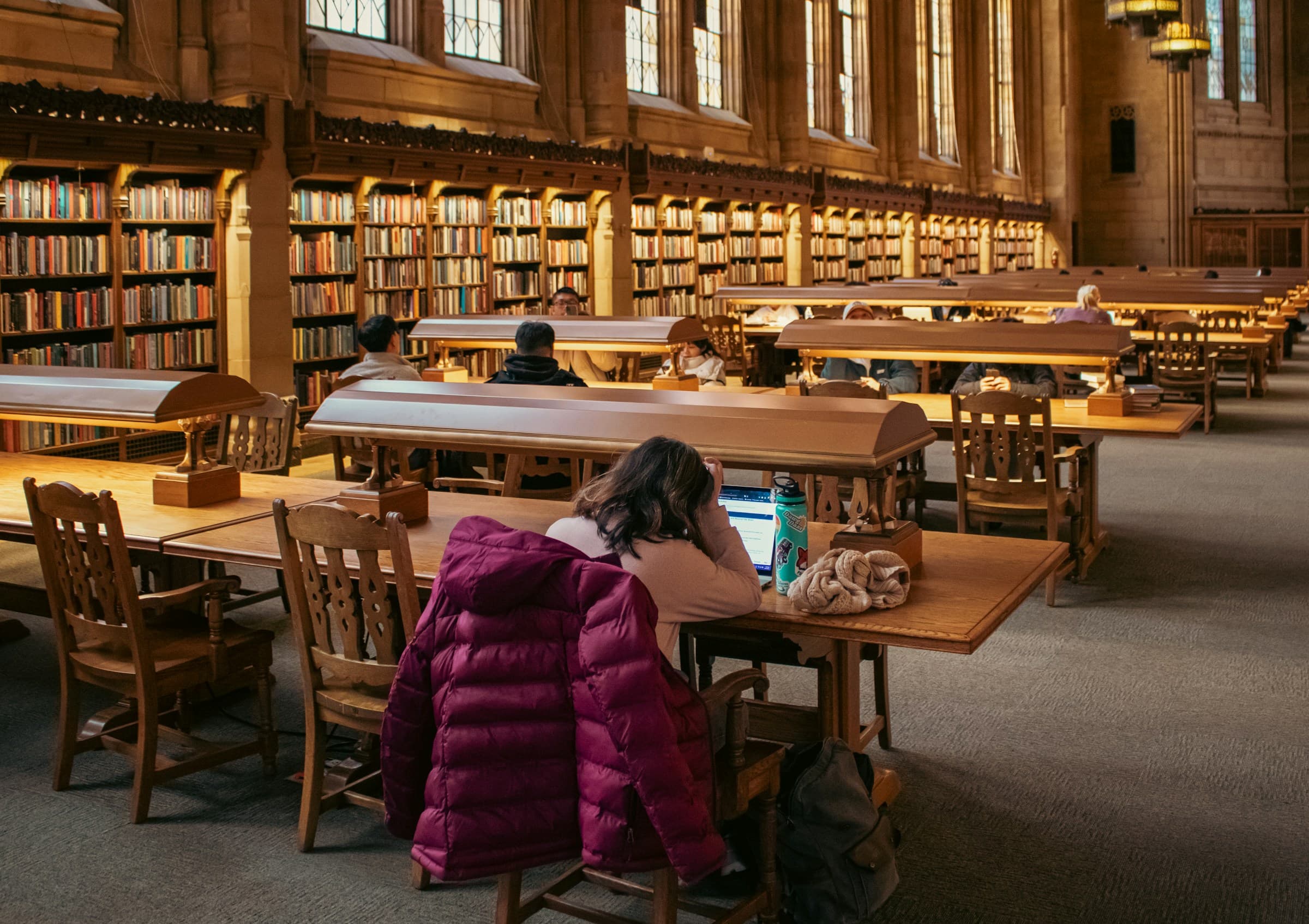 Students studying in a large reading room